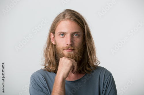 A Young Guy With A Beard Mustache Blond Hair To The