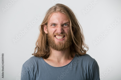 Young Bearded Guy With Grin Like A Lion Has Mustache Blond