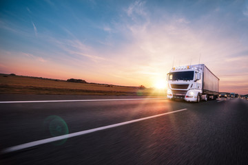 Truck with container on road, cargo transportation concept.