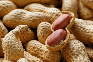 Peeled peanut on well peanuts. Peanuts, for background or textures.