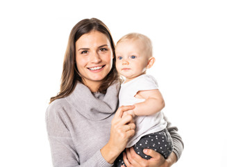 Wall Mural - A mother holdng his baby on studio white background