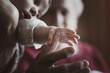 © Alexander - baby hand on old hand
