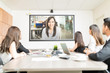 © AntonioDiaz - Business Executives Taking a Video Call in a Meeting Room