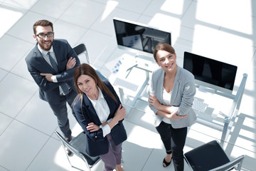 Canvas Print - top view. three employees standing in the office