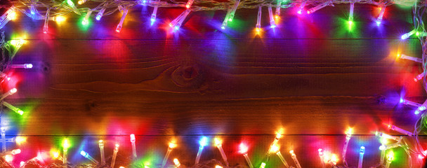Wall Mural - colorful string lights on wooden - christmas frame