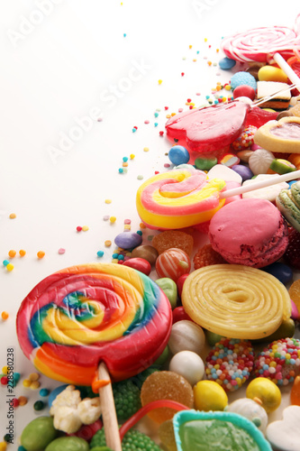 Plakat candies with jelly and sugar. colorful array of different childs sweets and treats.