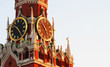 Kremlin Clock or chimes, historic clock on the Spasskaya Tower of the Moscow Kremlin, Russia. Panoramic view, sunset, sunlight