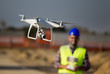 © Budimir Jevtic - Construction worker with drone at building site