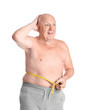 Fat senior man with measuring tape on white background. Weight loss