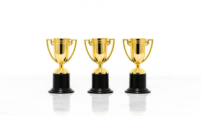 Golden trophy cup isolated on white background.