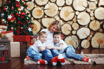 Wall Mural - Family around a Christmas tree.