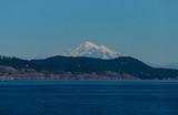 Fototapeta Tęcza - view of mount baker over the island on the ocean on a sunny day