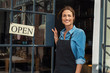 © Rido - Woman at small business entrance