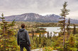 © Maridav - Alaska hiking man travel outdoor lifestyle, Young traveler hiker at mountains landscape in autumn.