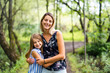 © Louis-Photo - Portrait of a happy young girl outdoors forest with babysitter