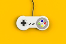 Video Game Console GamePad. Gaming Concept. Top View Retro Joystick Isolated On Yellow Background, 3D Rendering