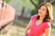 © tpap8228 - Asian girl smiling and feeling happy in the park in a sunny summer day, Have a beautiful day and happy concept.