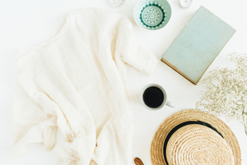 Wall Mural - Home office desk with coffee, book, straw hat and blanket on white background. Flat lay, top view.