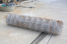 Rolls Of Wire Mesh Steel For Put A Pile On The Ground. Steel Reinforced Rod For Concrete Construction.