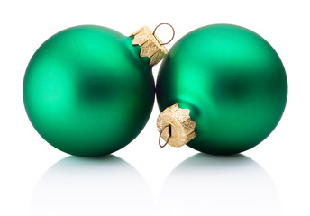 Two Christmas green baubles isolated on white background