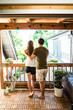 © Westend61 - Rear view of couple standing on balcony