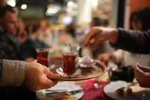 Man Serving Delicious Turkish Tea.