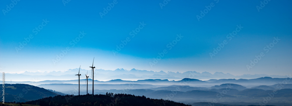 Windräder vor Alpenpanorama im schwarzwald - obrazy, fototapety, plakaty 