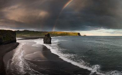 Black Sand Beach Reynisfjara in Iceland. Windy Morning. Ocean Waves. Colorful Sky. Morning Sunset.