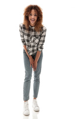 Wall Mural - stylish young woman in plaid shirt and jeans.