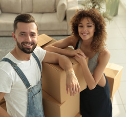 Portrait of a young family in a new apartment.