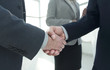 © ASDF - Close up business man handshake together on meeting room