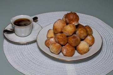 Bowl of mixed fritters with cup of coffee, Spain