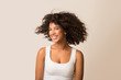 © Prostock-studio - African-american woman fooling with her curly hair