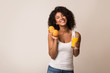 © Prostock-studio - Excited black woman with oranges and juice