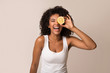 © Prostock-studio - Excited african-american woman holding half of lemon