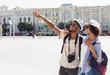 © Prostock-studio - African-american couple of tourists sightseeing in city