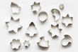 Various Christmas-themed cookie cutters.Christmas cookie cutters on white. Holiday card.