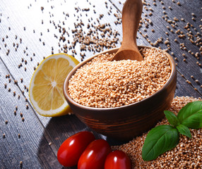 Bowl of amaranth grain on wooden table