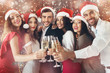 © Prostock-studio - Diverse friends clinking with champagne glasses on New Year's Eve