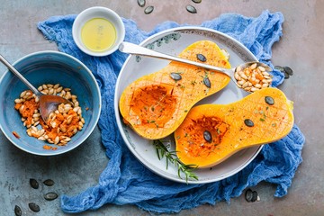 Pumpkin with different vegetables on the old wooden table top view ,Butternut