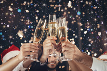 Clinking Glasses Of Champagne In Hands At New Year Party