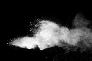 Wall Mural - Explosion of white dust on black background.