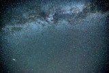 Fototapeta Kosmos - Night sky with the Milky Way galaxy and Andromeda galaxy bottom left amongst countless stars. Constellations swan (Cygnus), Cepheus and Pegasus can be seen.