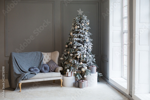 Christmas tree in the interior in gray