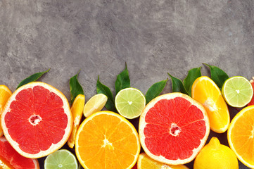 Wall Mural - Fresh ripe sweet citrus fruits colorful background: orange, grapefruit, lime, lemon