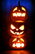 © Devist - Three Halloween pumpkins on dark background