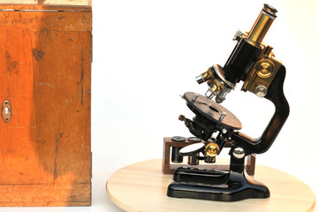 Antique binocular microscope with wooden case