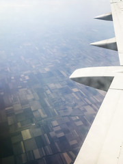 Poster - view of aircraft wing over country fields