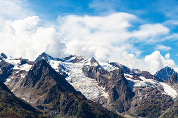 Wall Mural - snow-covered mountain tops near Dombay village