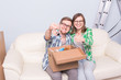 © satura_ - Family, new apartment and relocation concept - Young couple moving in new house